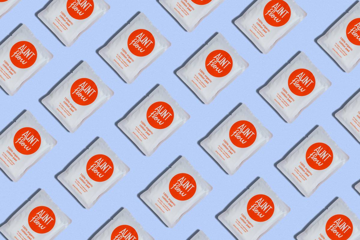 Woman using sweat wipes for body after workout at gym locker room