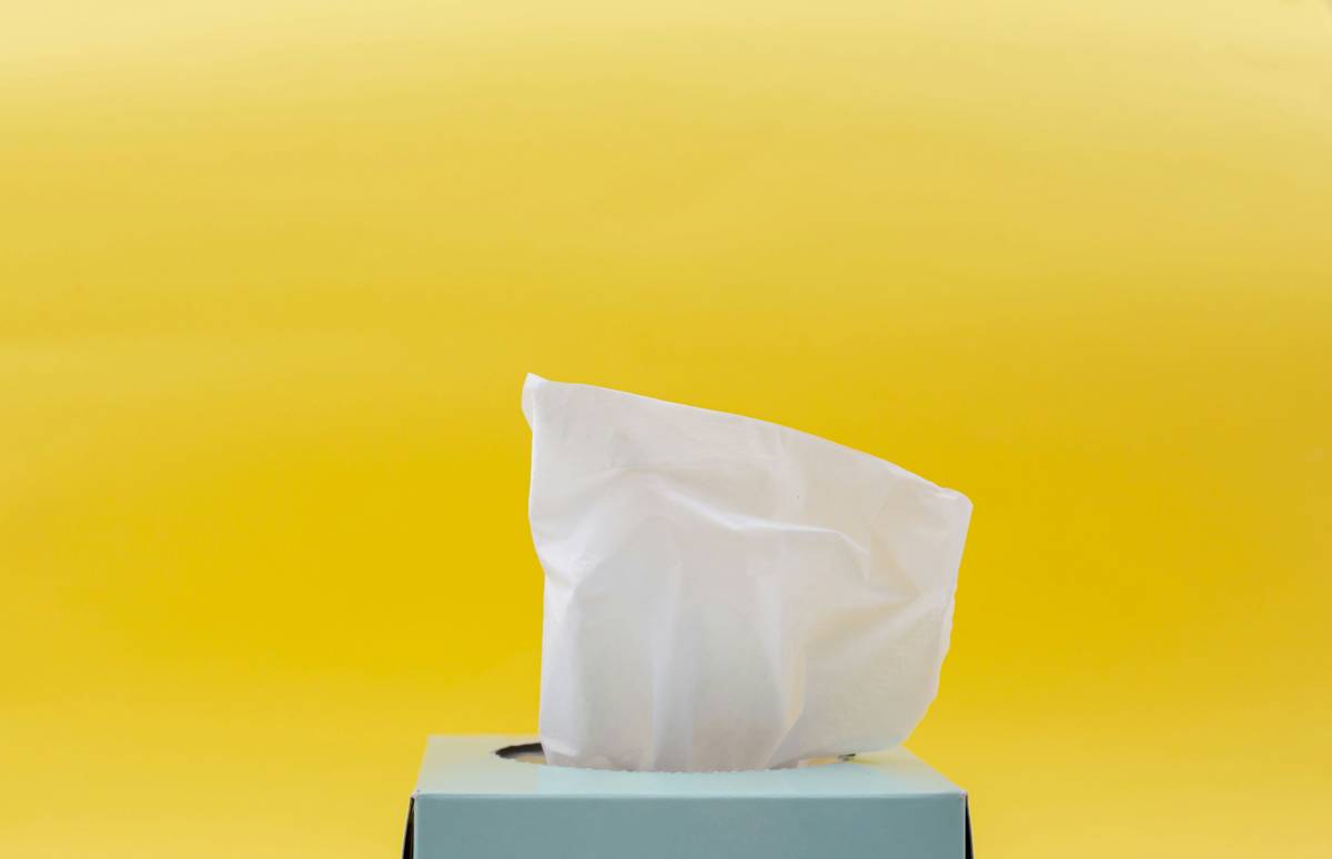 Woman using johnson and johnson make up wipes to remove eye makeup at night